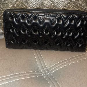 Black spiked valentino very nice lots of room for cards and cash etc..